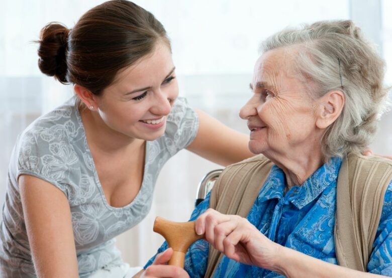 Young Caregiver with Elderly Woman Smiling Offering Homemaker Companionship Service in Florida